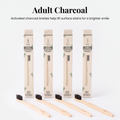 Adult Charcoal: four bamboo toothbrushes with charcoal-infused black bristles