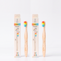 Two Rainbow kids bamboo toothbrushes with packaging