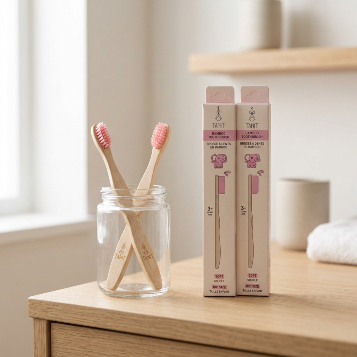 Pink Elephant kids bamboo toothbrushes in a jar on a bathroom counter