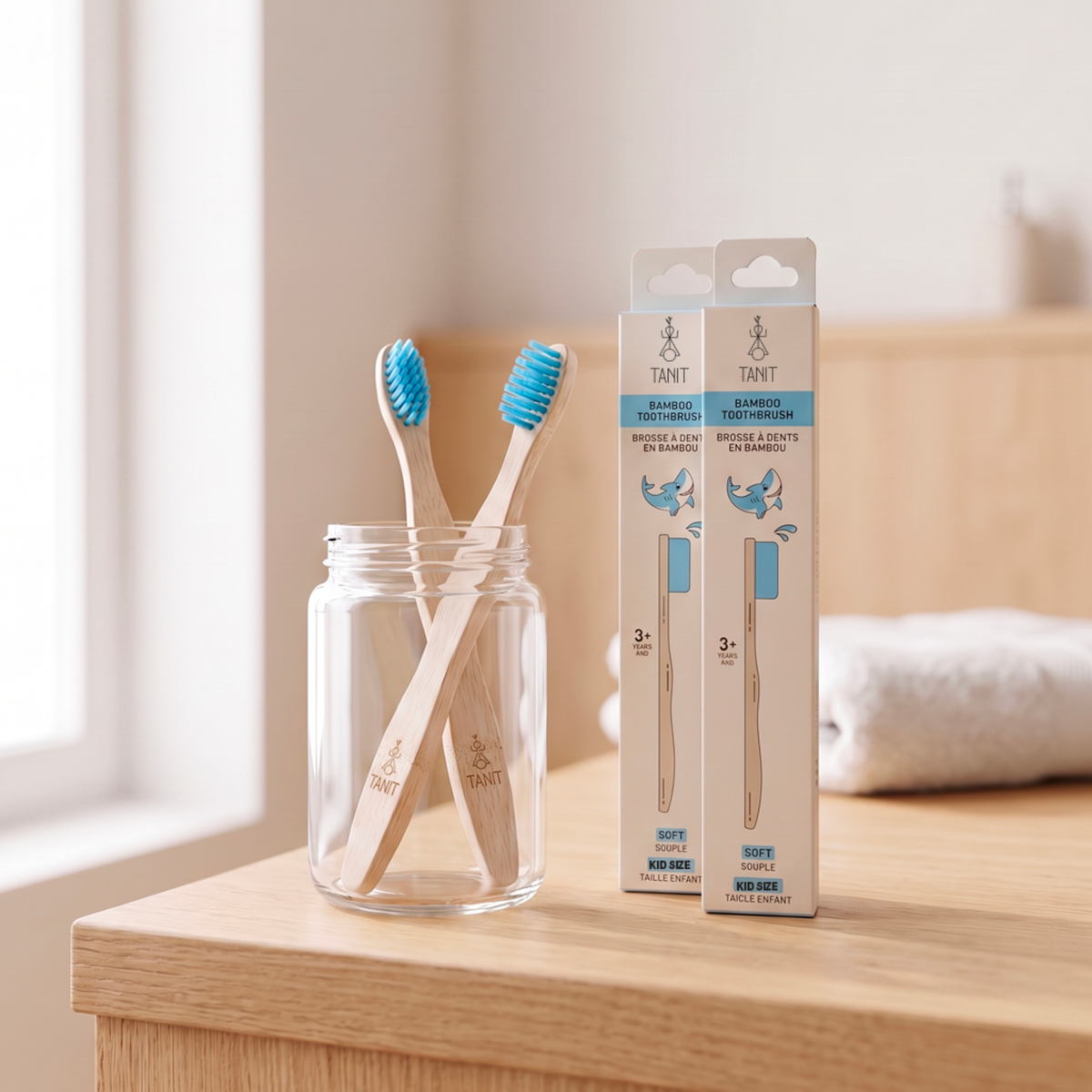 Blue Shark kids bamboo toothbrushes in a jar on a bathroom counter